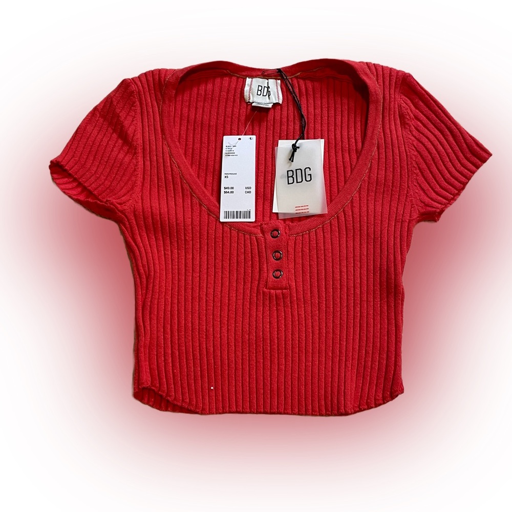 The cutest urban outfitters crop top in a bright red orangey color.